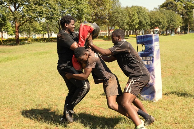 Peter Bukhala instructing an athlete on the pitch2